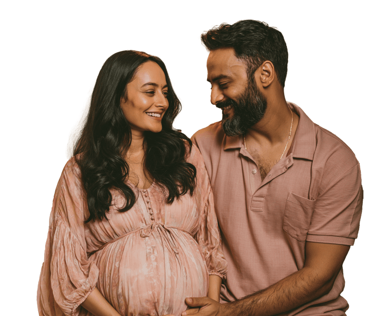 Expectant couple sharing a joyful moment — compassionate maternity care at Dr. Sulochana's Hospital